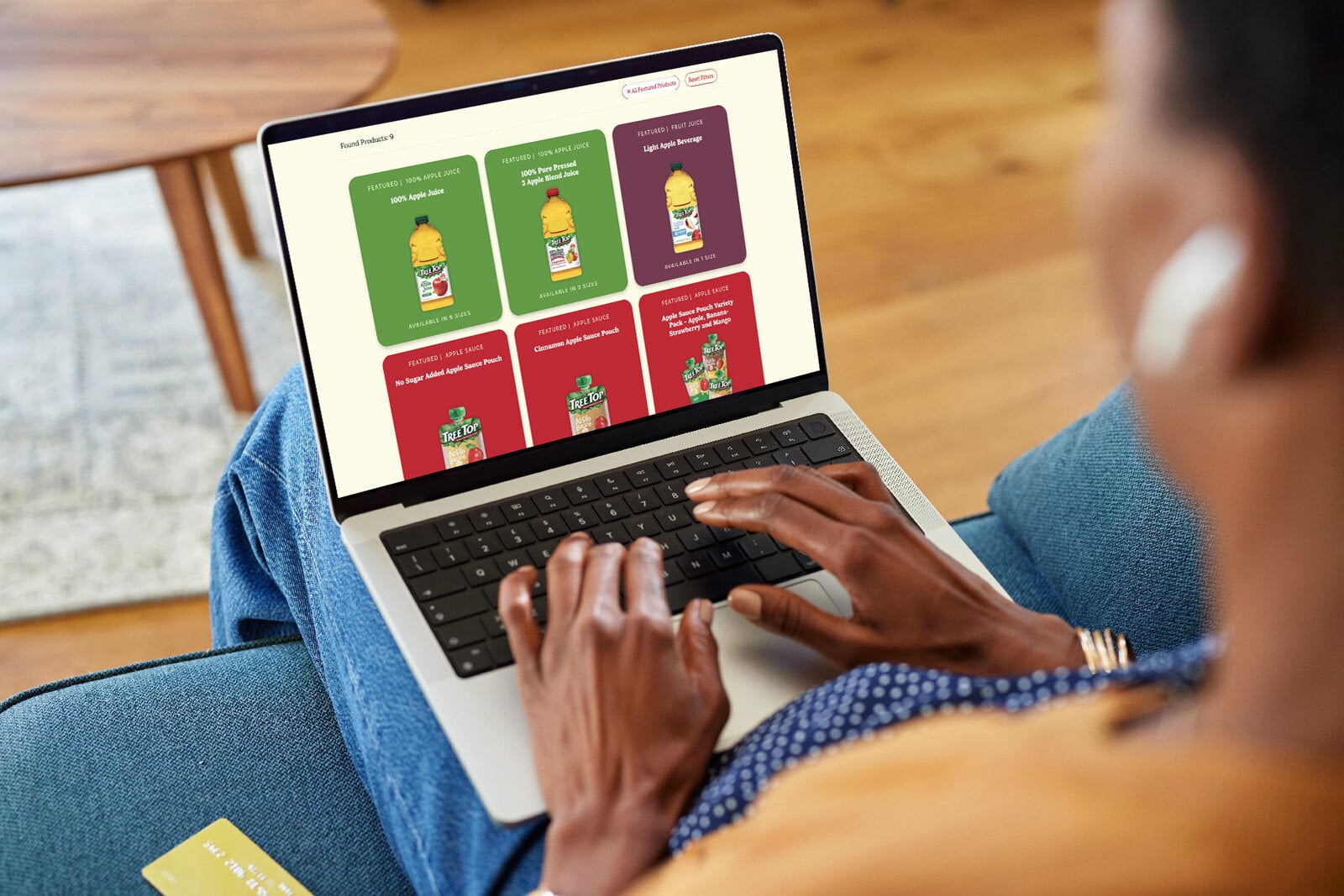 Woman on a laptop enjoying the Tree Top website.