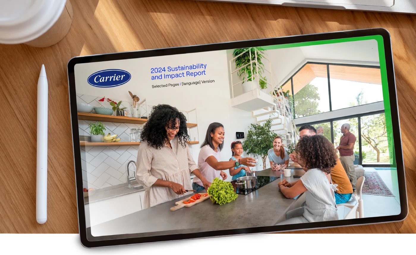 Carrier Impact report cover on iPad, family in kitchen cooking