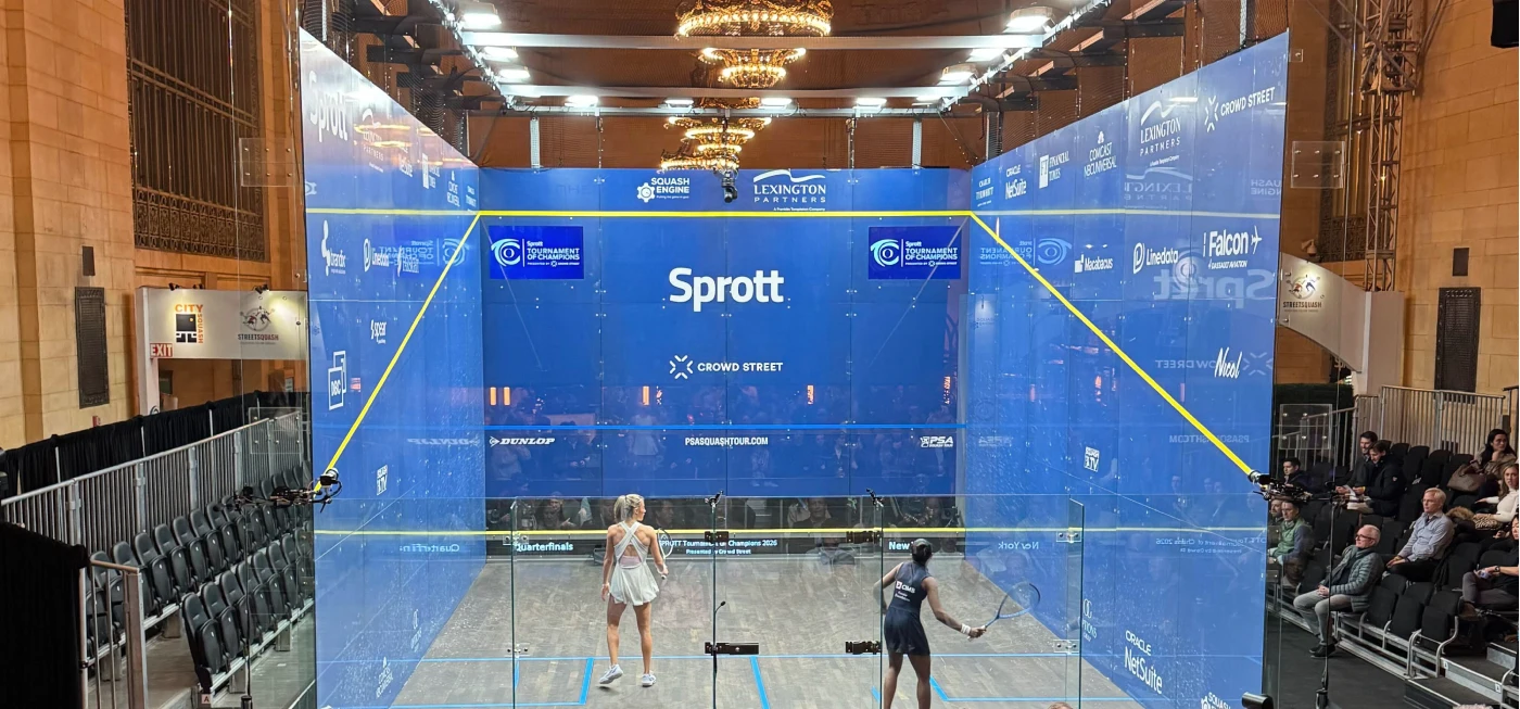 Women playing tennis in Sprott branded gear