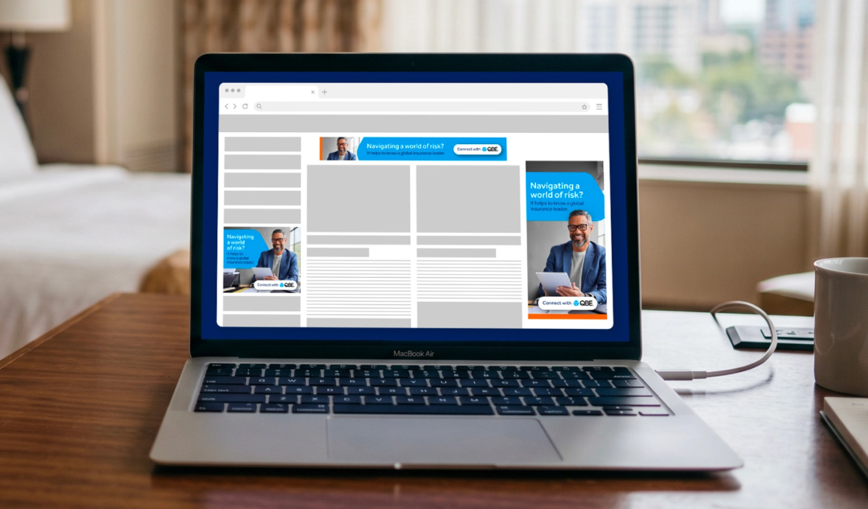 QBE banner ads on laptop