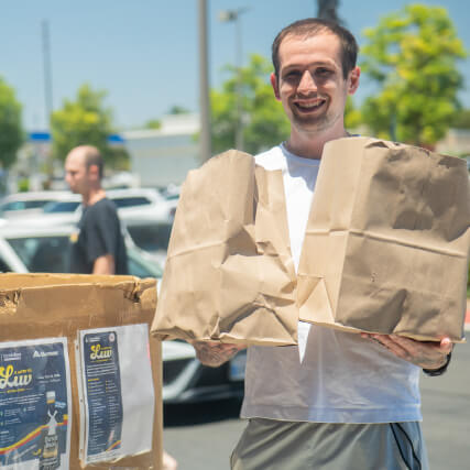 Man carrying in donations