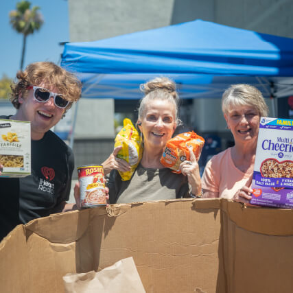 Group photo next to donations