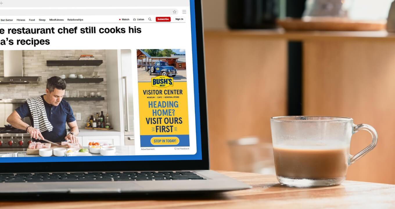 Banner ad on laptop while someone explores a food blog